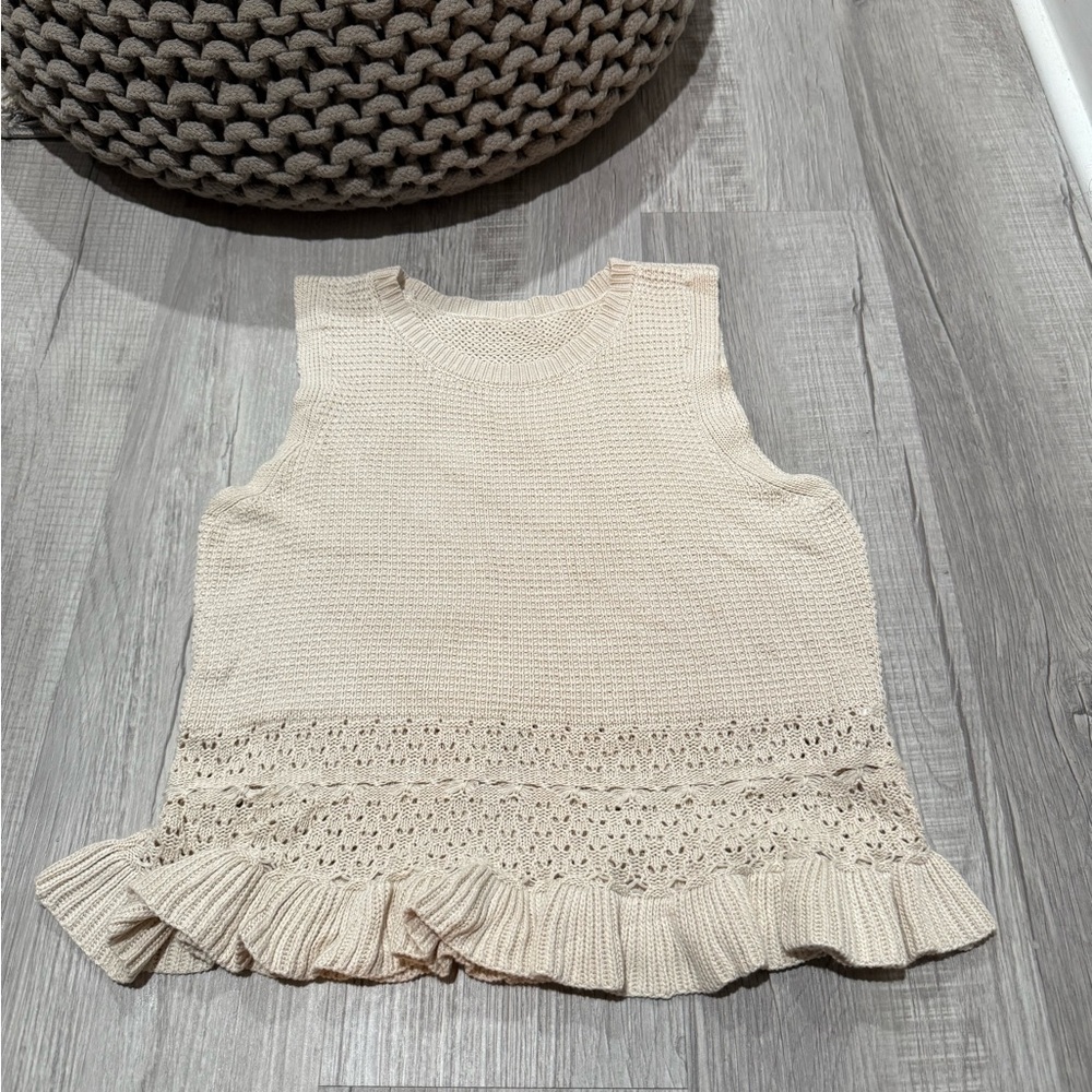 Cream Sleeveless Knit Top with Ruffle Hem